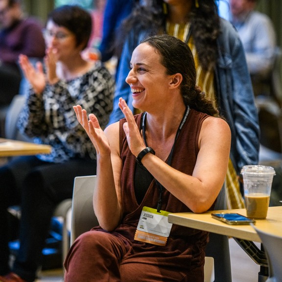 Conference participants applaud