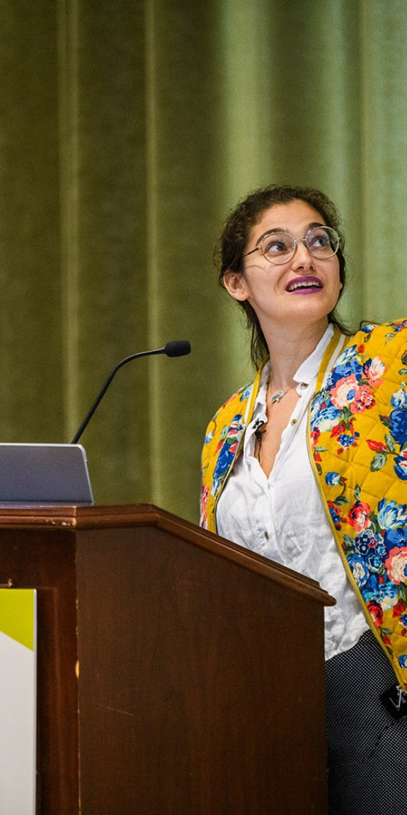 A woman presents at the Climate Changes Everything conference
