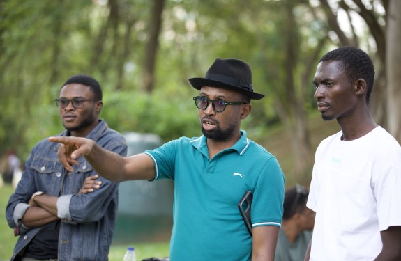 Men talk outside during a solutions journalism event