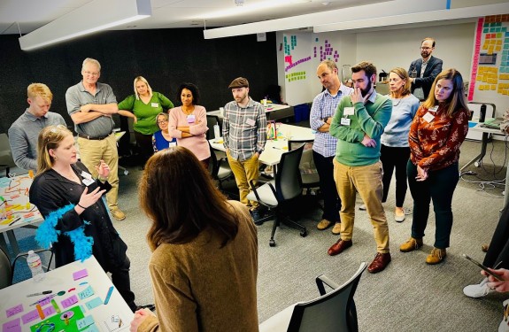 Participants in a workshop use colorful materials to brainstorm